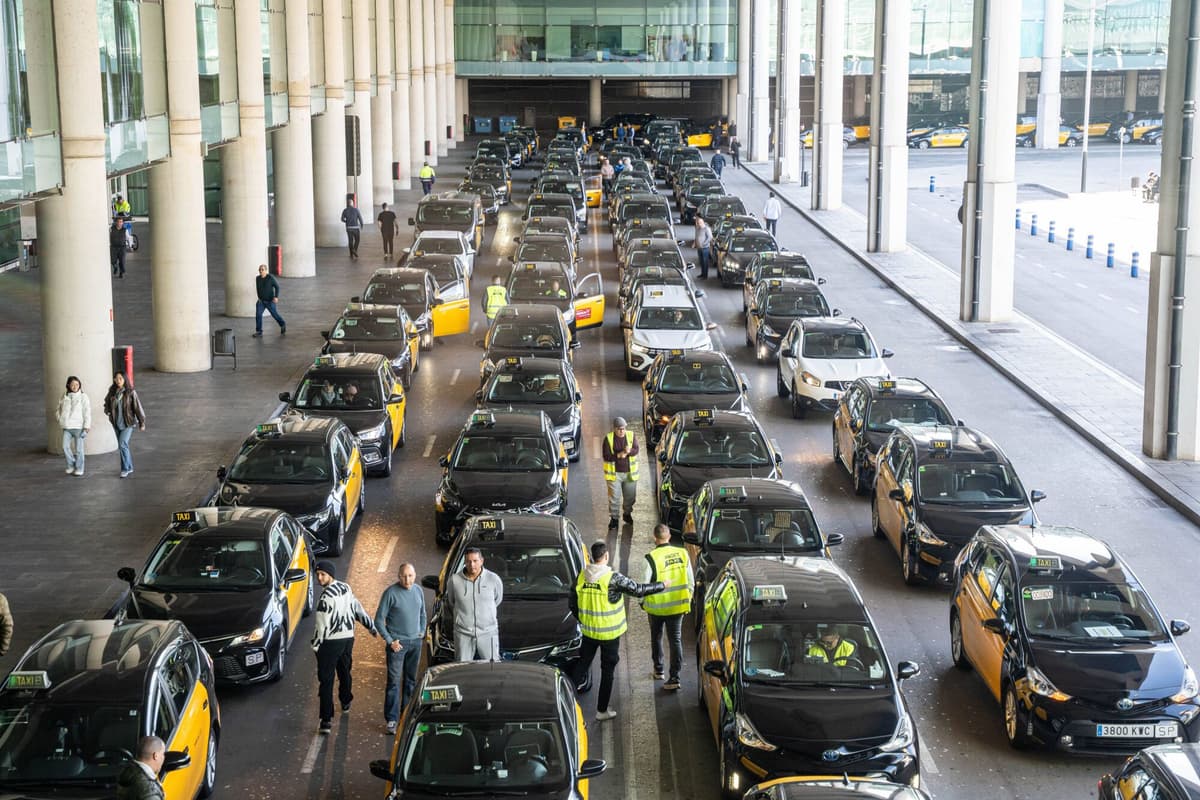 Official Barcelona taxi — white with black markings at El Prat airport